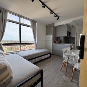 departamento-miramar-living-comedor-vista-ciudad-01